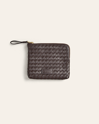 Woven leather pouch with a brand logo on a light gray background