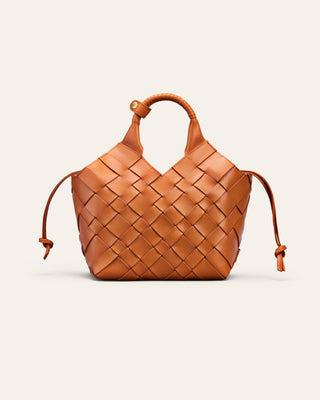 Cala Jade orange woven shoulder bag on a beige background
