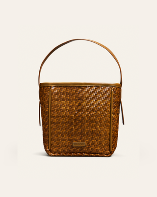 Cala Jade iwa mini sepia brown shoulder bag on a beige background