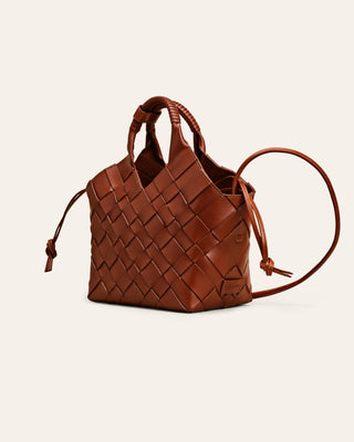 Cala Jade MISU Nutmeg brown leather shoulder bag on a beige background