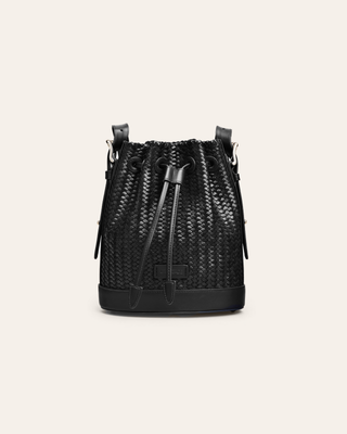Cala Jade mini black woven leather bucket bag on abeige backgroundf