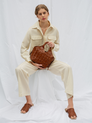 Cala Jade brown leather shoulder bag on model