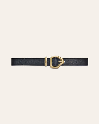A black leather belt with a gold buckle in a beige background