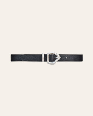 A black leather belt with a silver buckle on a beige bckground