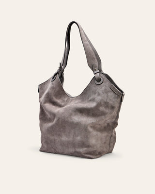 Gray suede leather handbag on a light beige background
