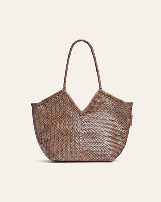 Woven handbag on a beige background from Cala Jade