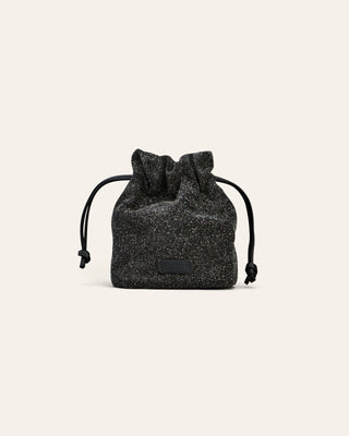 Cala Jade Jael Black beam drawstring pouch on a beige background