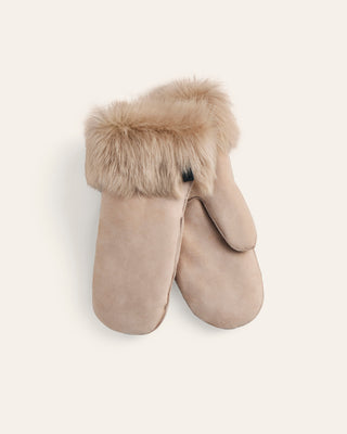 Beige sherling mittens with fur trim on a light beige background