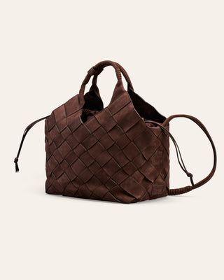 A brown woven nubuck leather shoulder bag on a beige background