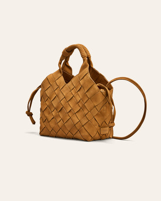 Brown woven nubuck handbag on a light beige background