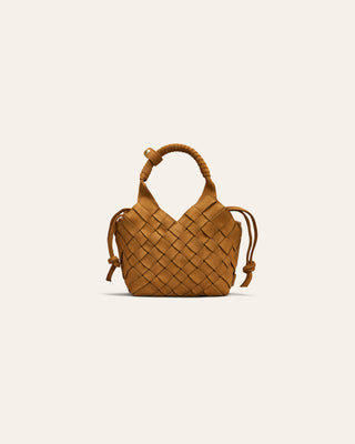 Woven handbag on a light beige background