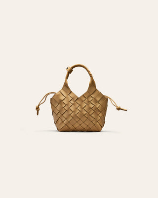Woven handbag on a light beige background