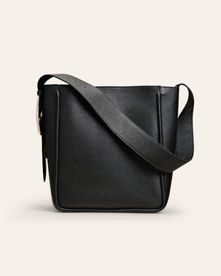 Cala Jade Masago black leather tote bag on a beige background