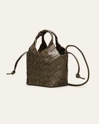 Cala Jade MISU Kombu Green leather shoulder bag on a beige background