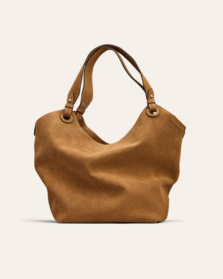 Brown suede leather handbag on a light beige background