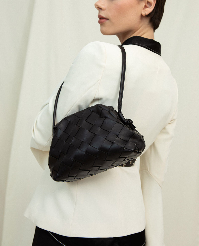 Cala Jade black clutch bag on model